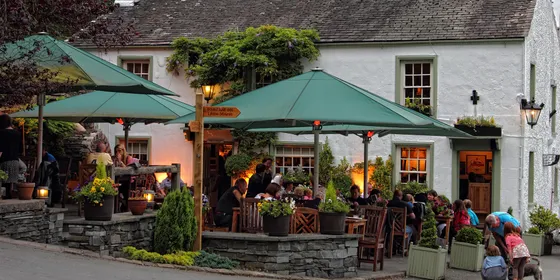 The Masons Arms at Strawberry Bank with guests dining outside on the terrace