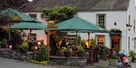 The Masons Arms at Strawberry Bank with guests dining outside on the terrace